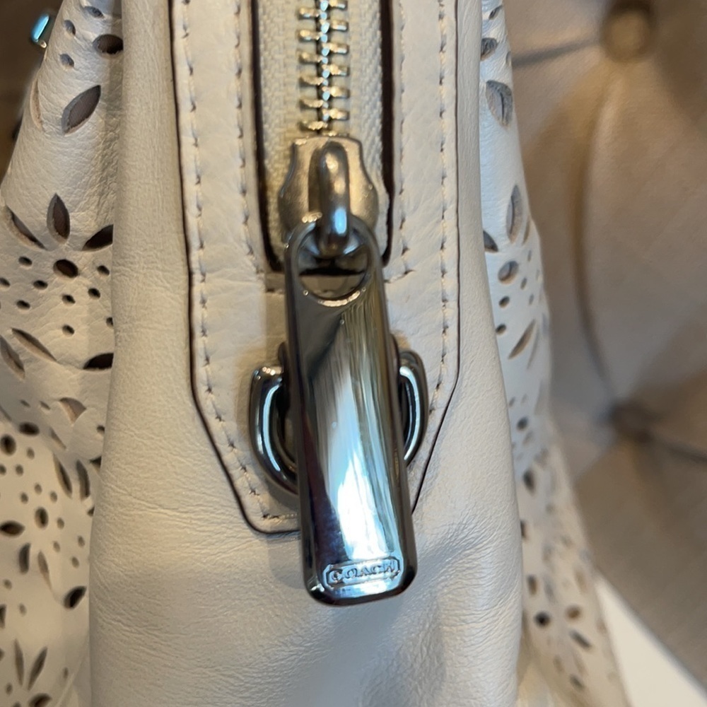 Coach Taylor Perforated Putty White Leather Satchel
12"L x 4.5"W x 8"H - Picture 4 of 11